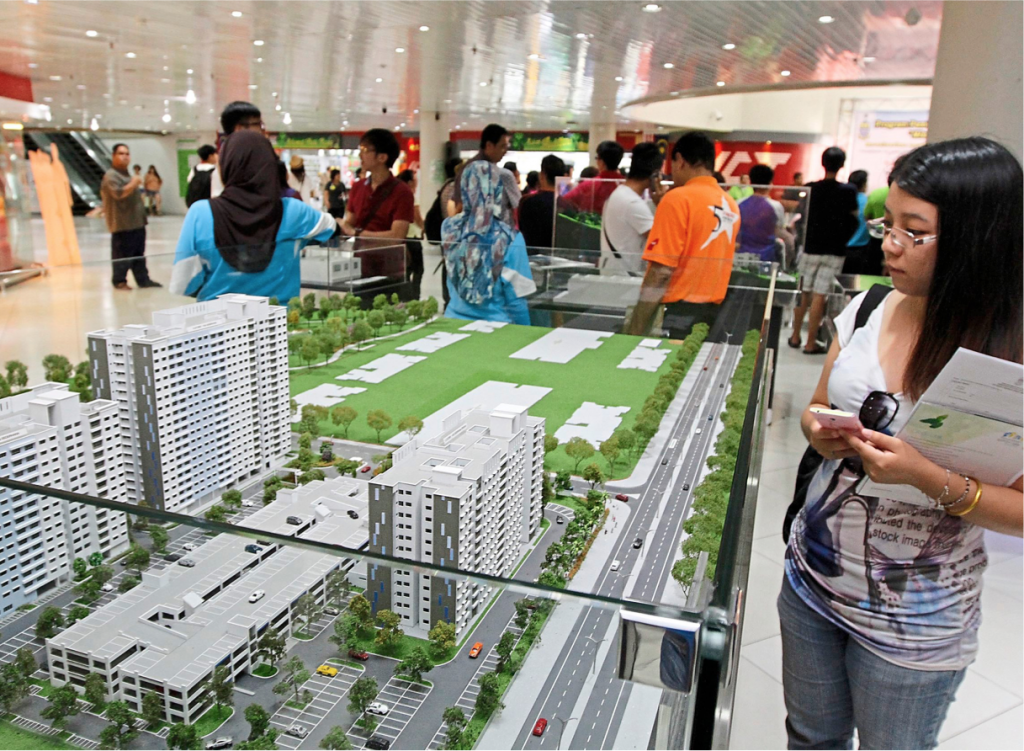 Members of the public looking at model houses of some of the affordable housing projects on display in Penang.