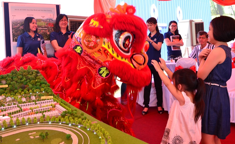 A lion dance entertaining guests during the Chinese New Year event at the Kensington Gardens in Jalan Brook, Penang.
