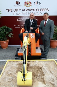 Nazri manning the excavator at the groundbreaking ceremony of Hilton Hotel at I-City in Shah Alam. On the right is I-Bhd executive chairman Tan Sri Lim Kim Hong.