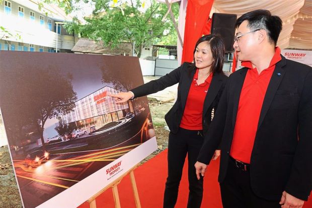 New landmark: Cheah and Sunway Property Development Division deputy managing director Tan Wee Bee with an artist’s impression of Sunway Property Anson.