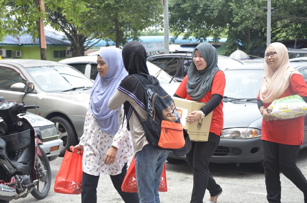Volunteers making their way to distribute food and hygiene packages to selected recipients.  