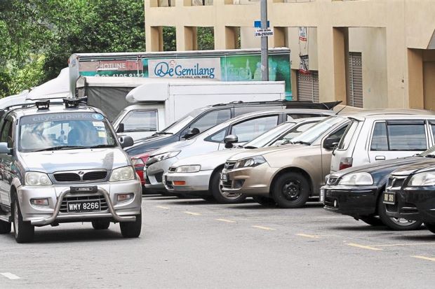 The scan car making its rounds to detect vehicles that have not paid the parking fee. — Photos: AZLINA ABDULLAH/The Star