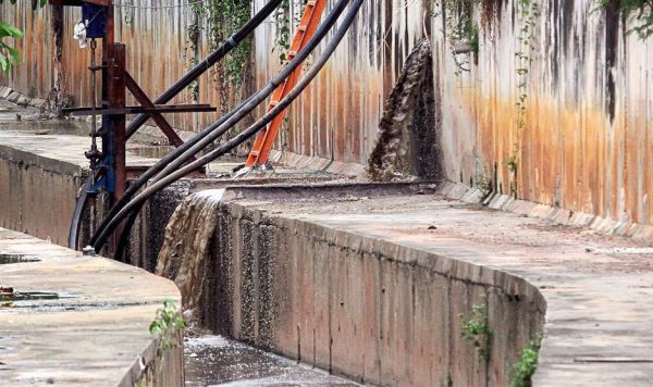 The factory also pumps water from the river behind the warehouse and dumps the used dirty water back into it.