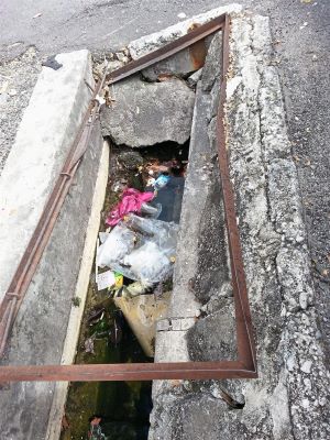 Broken drains filled with rubbish make things worse during flash floods.