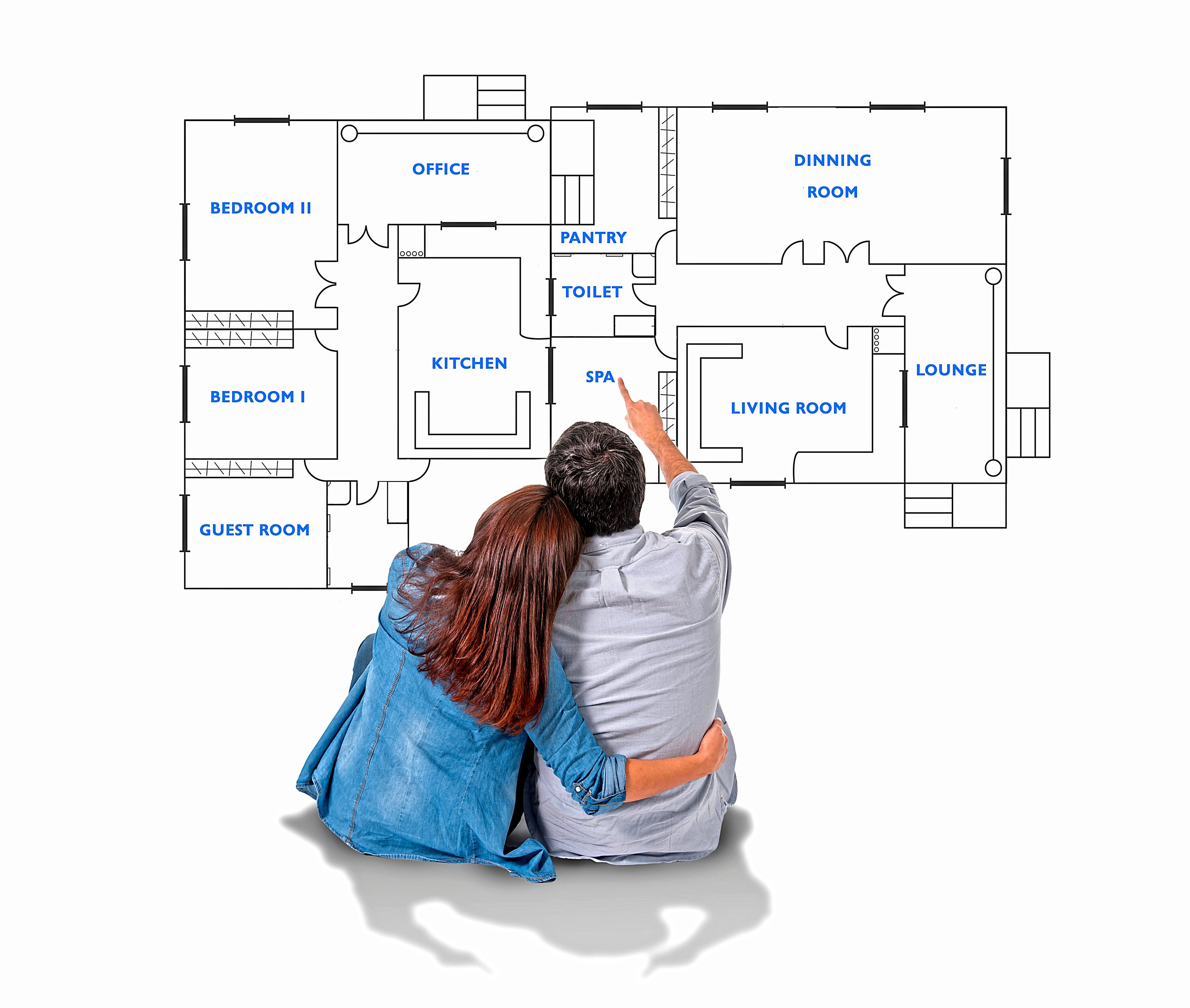 Young attractive couple in love happy together planning and pointing blueprints , floor plan and design of new house, home, flat or apartment imaging the distribution of the rooms in real state concept