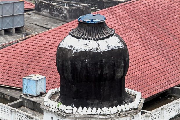 The spire of this dome collapsed late last year and has only been covered with a tarpaulin sheet.