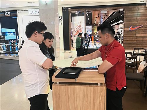 Weighing the options: Visitors getting to know more about the properties on the market.