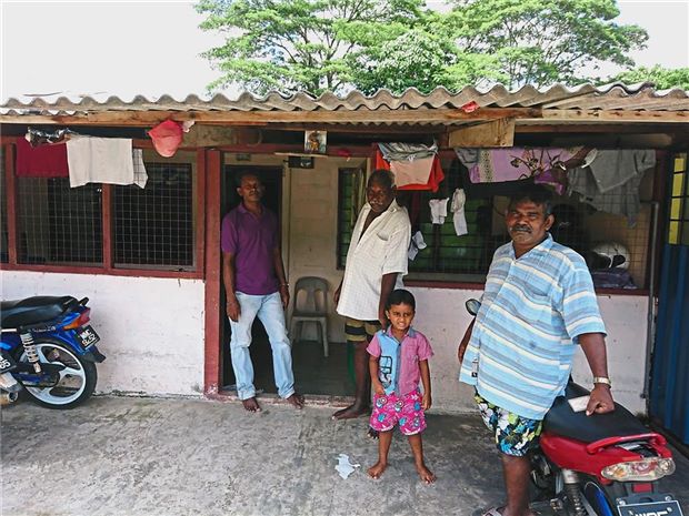 Velan (purple shirt) said many residents had been blacklisted after questioning whether servicing their loan would result in a promised apartment. Mookan (white shirt) said it was pointless asking his children to take over the loan, as he and his wife also needed a place in their old age.