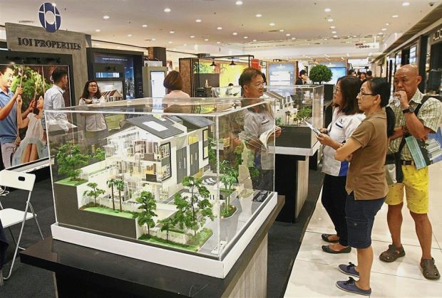 Visitors taking a closer look at the Cypress Villa project by IOI Properties.