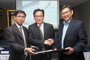 Deal sealed: (from left) Chew, Lasseters International CEO Paul Wong and AccorHotels vice-president, development, and executive director, Indonesia-Malaysia, Rio Kondo exchanging the documents.