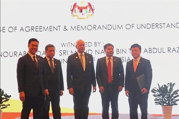 MoU signed: (from left) Titijaya deputy group MD Lim Poh Yit, Tan Sri Lim Soon Peng, Najib, China Railway Dongfang Group MD Cai Zemin and China Railway Engineering Corp (M) Sdn Bhd MD Wang Youping at the MoU signing in Beijing.