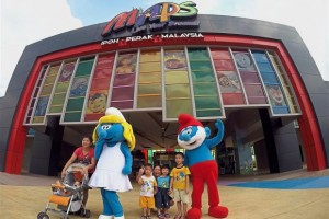 Children posing for a photo with Smurf characters near the entrance of the Movie Animation Park Studios. — SAIFUL BAHRI/The Star