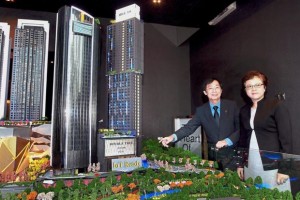 Eu (left) and Ong viewing a model of the Hill10 Residence at the launch of the loT-ready project in i-City, Shah Alam