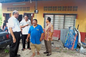 Bentan (in blue) showing the guests his uncompleted house that has been under renovation for over 20 years in Kampung Terang, Balik Pulau.