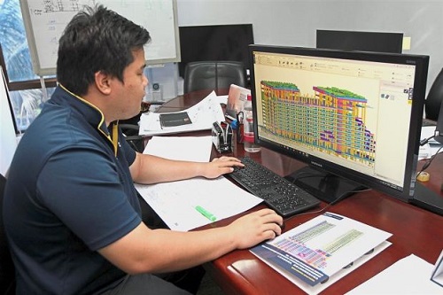 New software: An employee using the Building Information Modeling for a project.