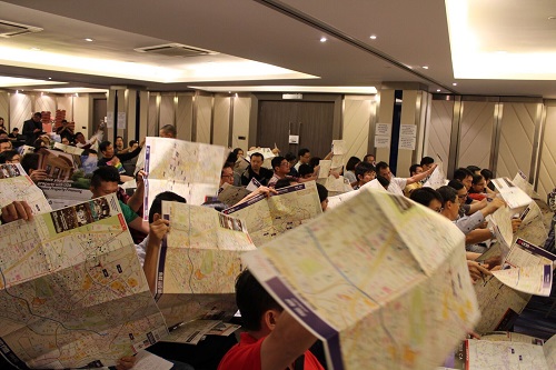 Participants perusing through the property maps
