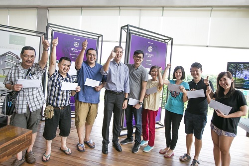 Khoo (4th from left) with the first eight buyers.