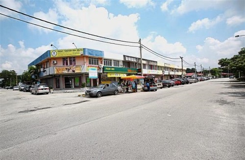 Part of Jalan Emas in Taman Melawis gets flooded during a downpour.