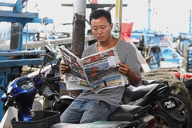 Fisherman Wong laments that now, just one small road accident will delay the lorries collecting the fish.