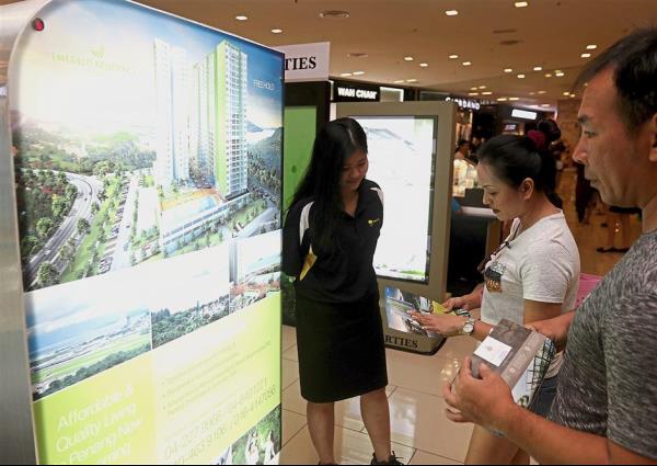 Visitors looking at the Emerald Residence project by TPPT Sdn Bhd.