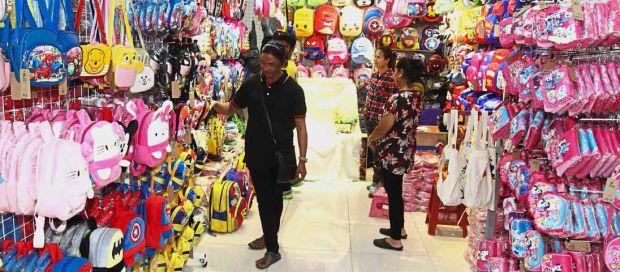 A shopper looking at the wide variety of bags sold at one of the shops in Plaza Haji Taib in Lorong Haji Taib, Chow Kit. — Photos: LOW BON TAT /The Star