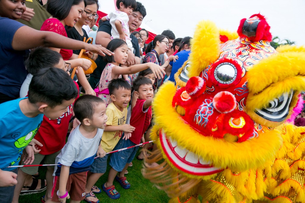Guests petting the 'friendly' lion for good luck