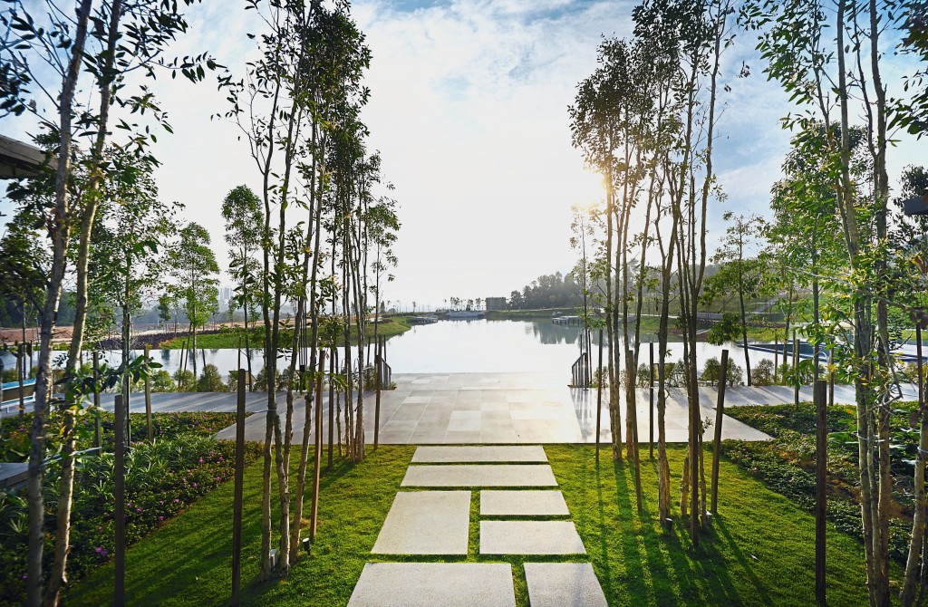 A clubhouse and an infinity swimming pool overlook the lake at Emerald Hills.