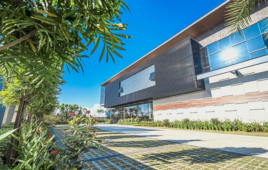 Lush greenery within the detached factory compound.