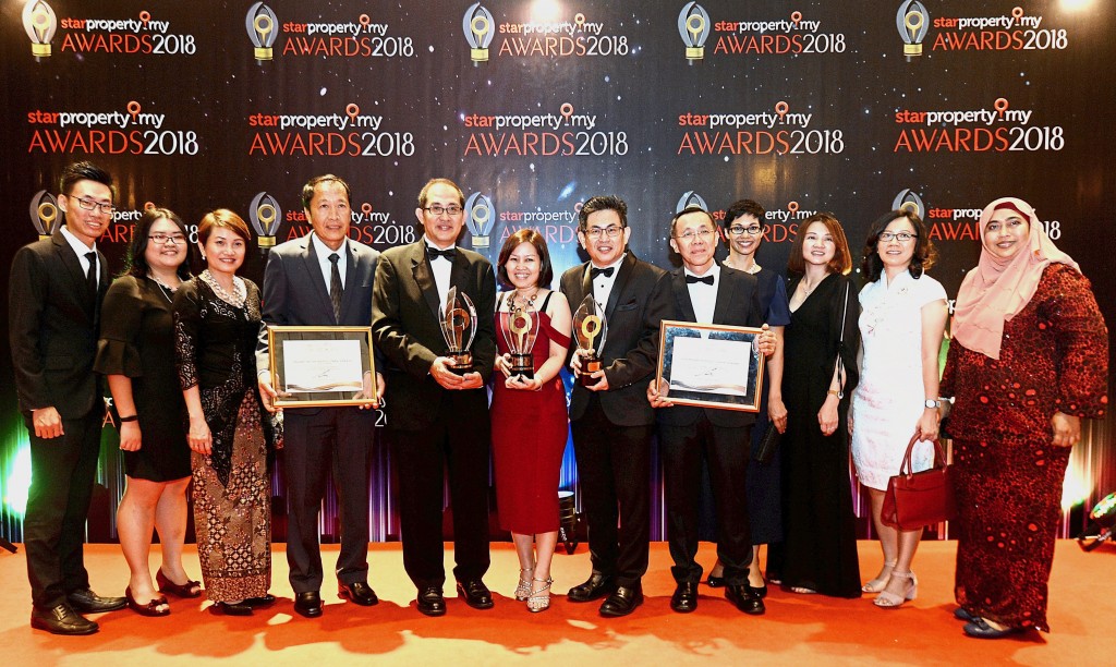 (Fifth from left) Paramount Property CEO Beh Chun Chong, business development manager Ooi Wan Ling and chief operating officer Wang Chong Hwa proudly showcasing their multiple victories with the team
