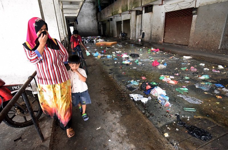 Resident throwing rubbish down of the flat at Teluk Indah, Prai, Penang.