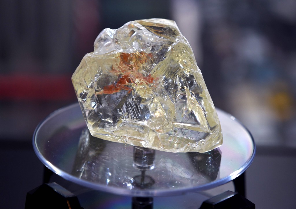 (FILES) In this file photo taken on December 4, 2017, the Peace Diamond is on display at the Rapaport Group in New York.  More than a quadrillion tons of diamonds or one thousand times more than one trillion, US researchers at the Massachusetts Institute of Technology reported this week. But don't expect a diamond rush. These naturally occurring precious minerals are located far deeper than any drilling expedition has ever reached, about 90 to 150 miles (145 to 240 kilometers) below the surface of our planet. "We can't get at them, but still, there is much more diamond there than we have ever thought before," said Ulrich Faul, a research scientist in MIT's Department of Earth, Atmospheric, and Planetary Sciences.   / AFP PHOTO / TIMOTHY A. CLARY
