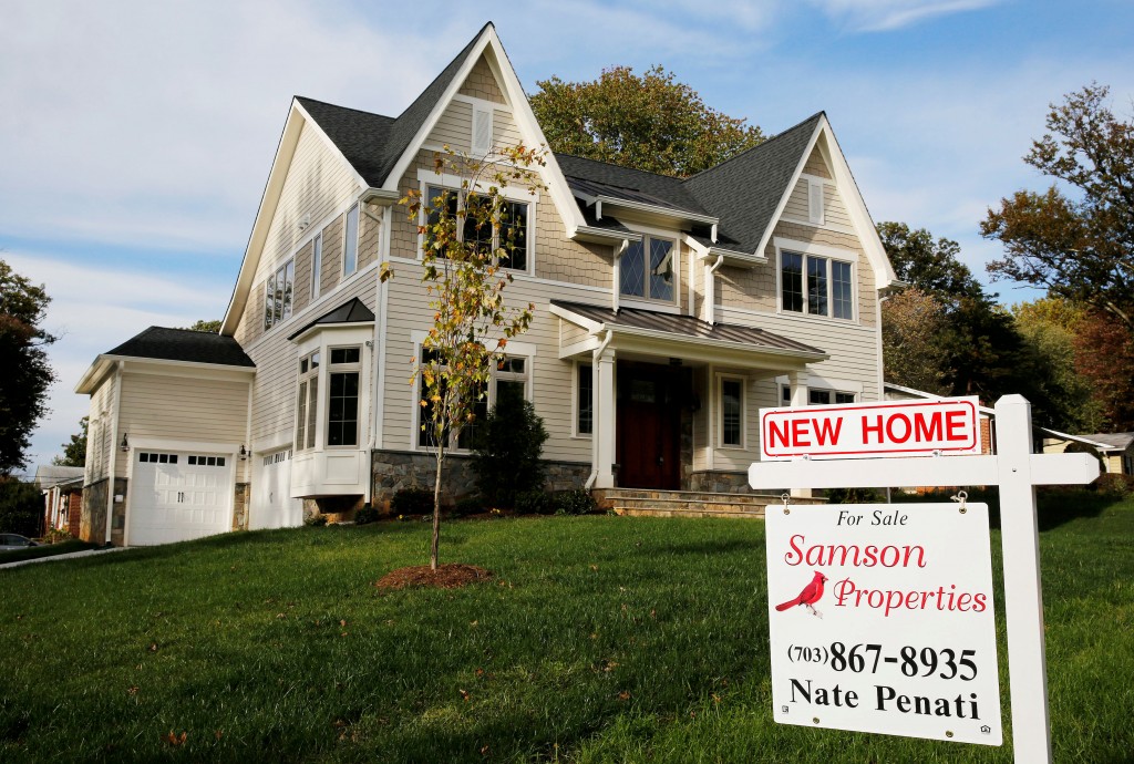 FILE PHOTO: A real estate sign advertising a new home for sale is pictured in Vienna Virginia