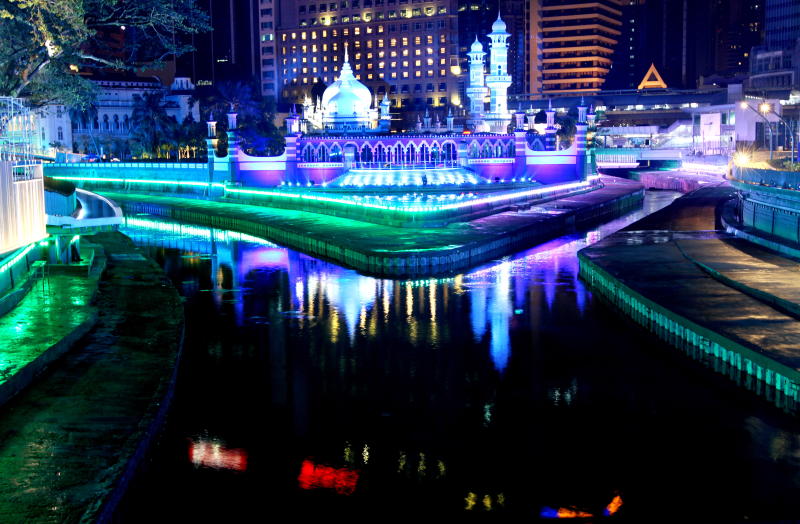 Masjid Jamek , Kuala Lumpur is flanked by the Gombak river (left) and the Klang river, as lit up as part of the River of Life project by DBKL.