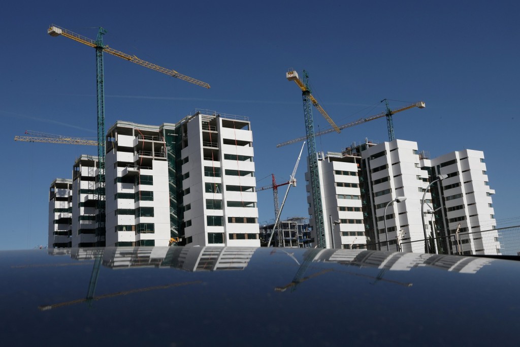 FILE PHOTO: Construction cranes are seen at a Q21 Real Estate apartment complex under construction in Madrid