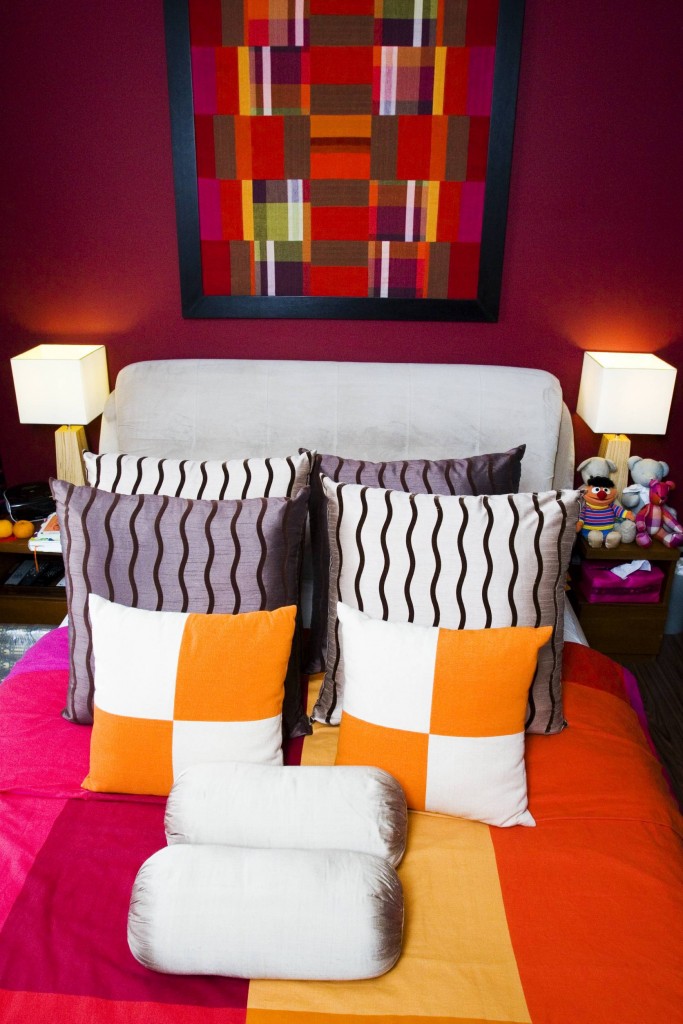 Eric's bedroom is as colourful as his personality. 