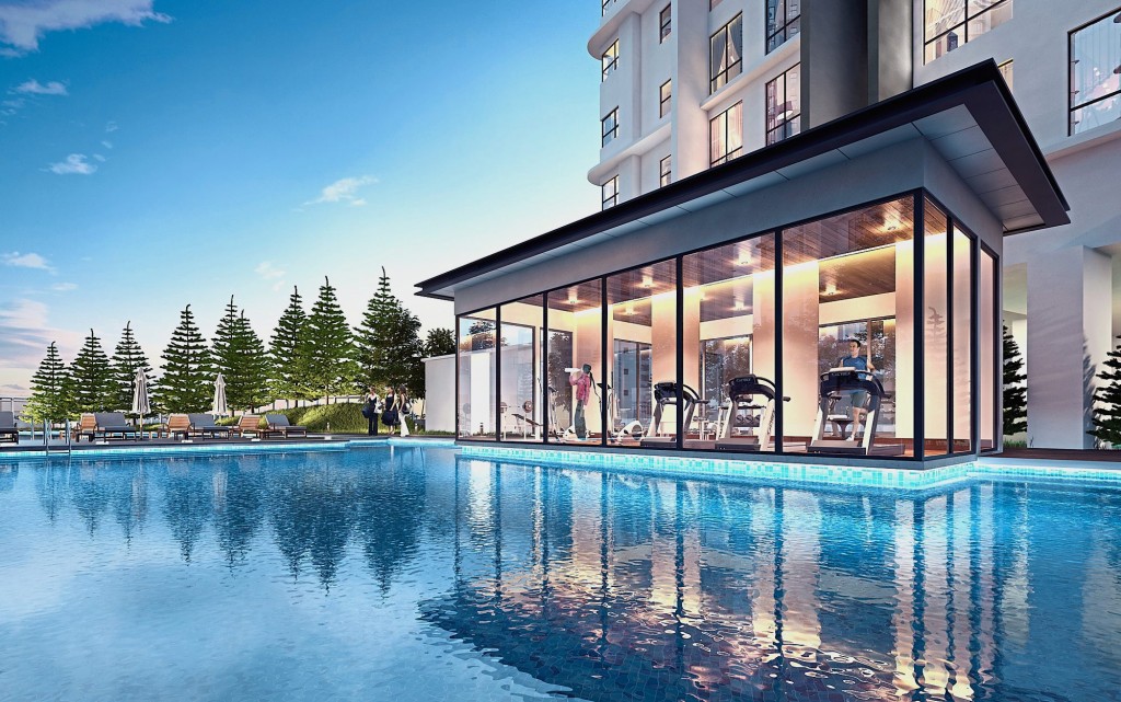 The well-equipped gymnasium overlooking the inviting swimming pool.