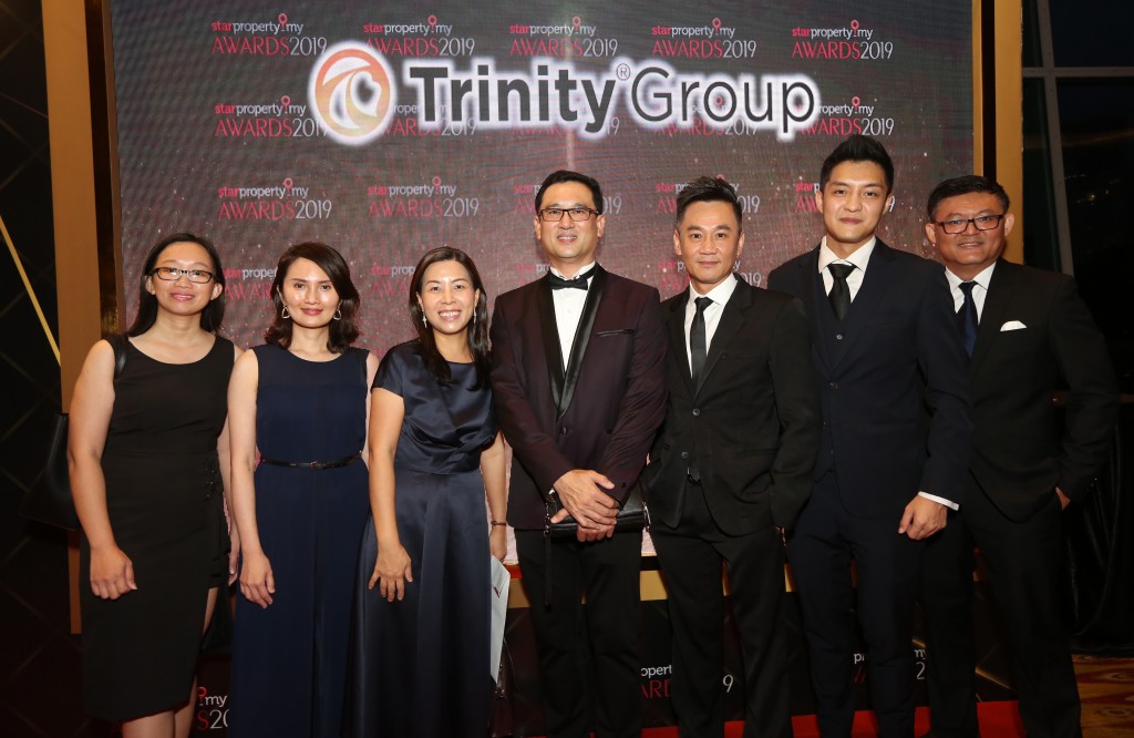 All smiles from Trinity Group Sdn Bhd managing director Datuk Neoh Soo Keat (centre) and his team at the awards night.