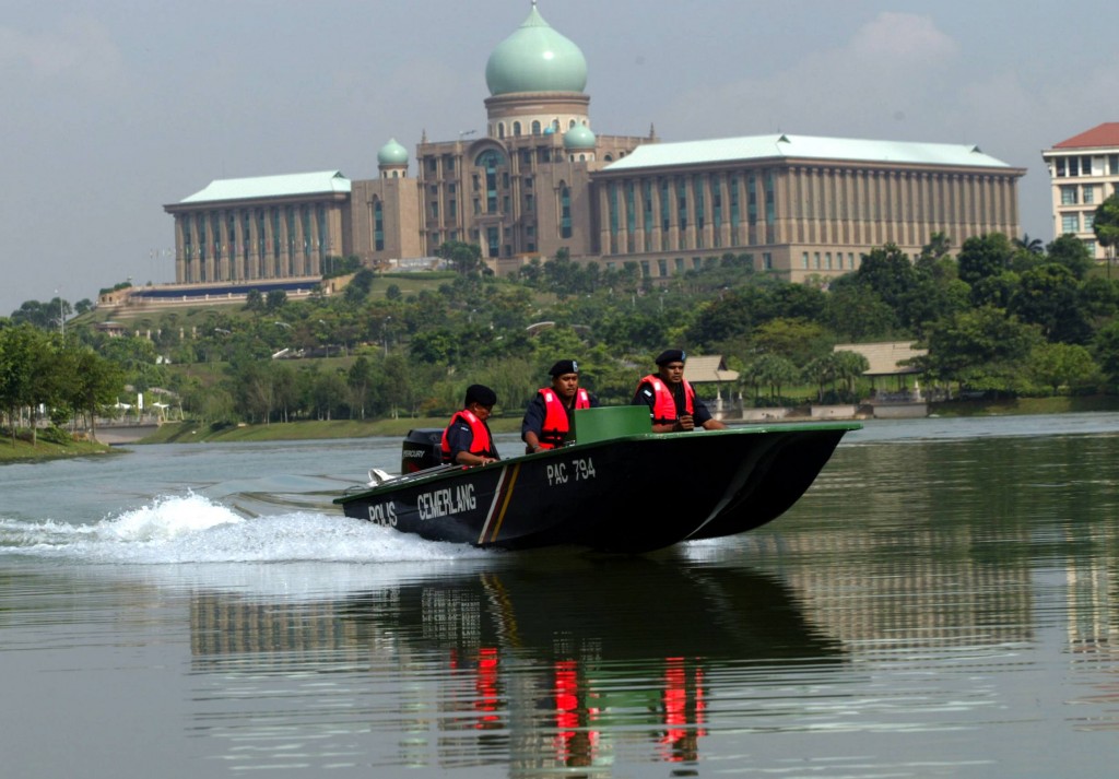 Putrajaya marine police doing their daily rounds around the Putrajaya Lake. The marine police patrol the lake around-the-clock to investigate possible security breaches especially near the residences of the PM and DPM.
