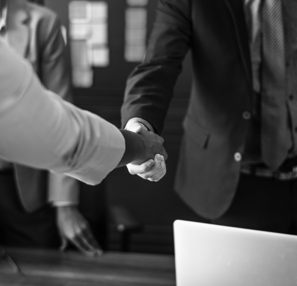 Business people shaking hands in a meeting room