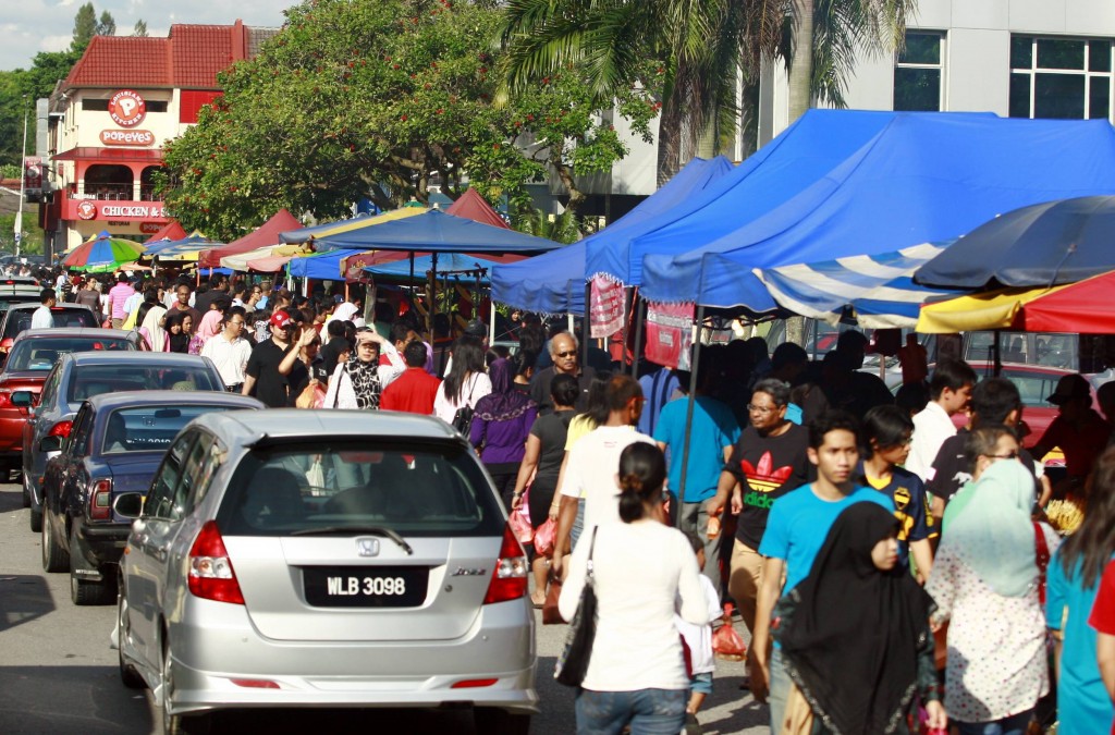 The Taman Tun Dr Ismail (TTDI) Ramadan bazaar started to get packed with people of all races and the roads were jammed with cars at about 5pm.