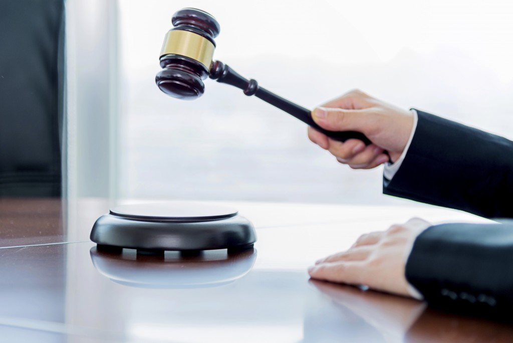 Generic: Female judge - Stock image Auction, Gavel, Legal System, Hammer, Human Hand