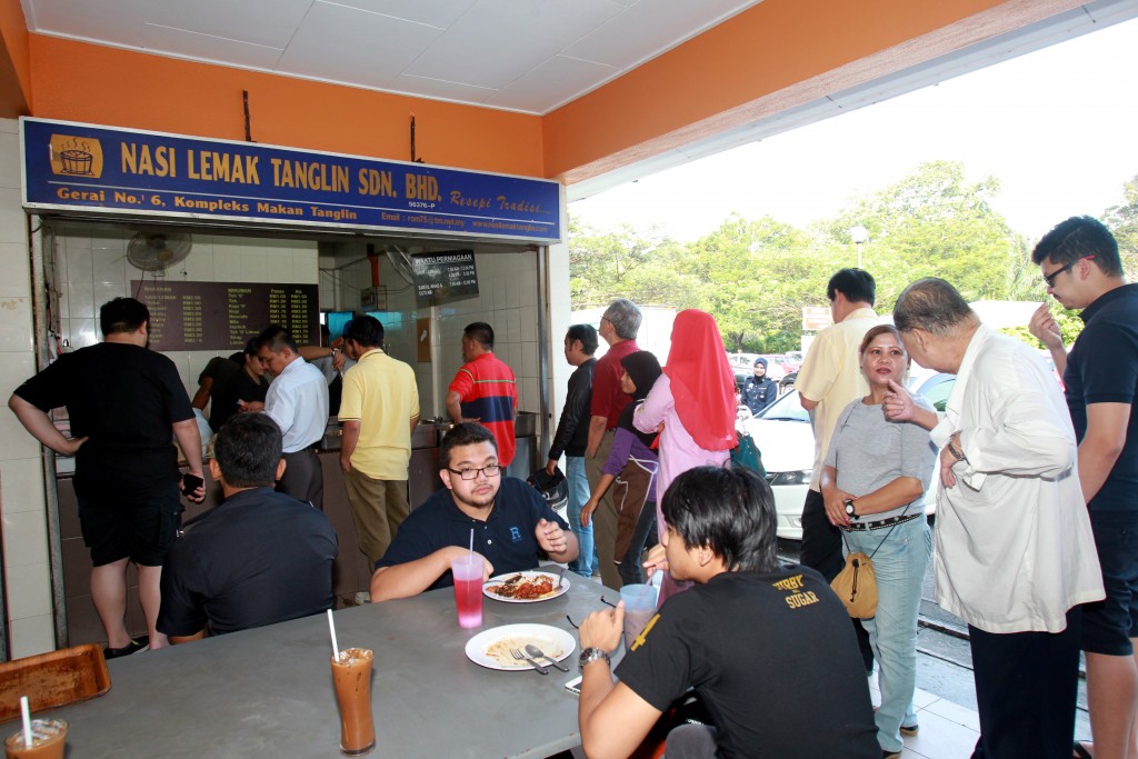 Patrons best visit Nasi Lemak Tanglin early as the lines are long and food finishes quickly. Art Chen / The Star.