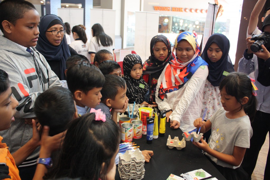 Children from the charity homes participating in a workshop to learn how to upcycle egg cartons into eggshell planter. The workshop was conducted by seven-year-old Helena Abdullah (right, holding paintbrush).