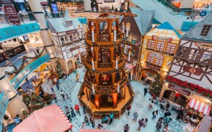 A replica of Altmarkt Square, where the market is located surrounded by traditional German buildings and décor in a Christmas setting