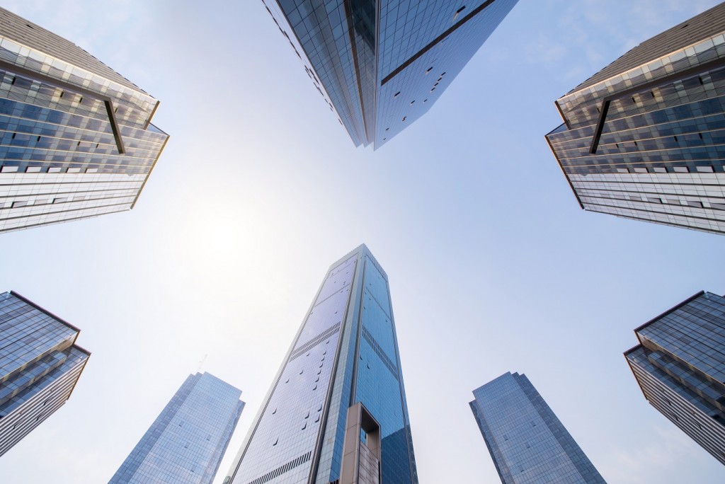 Looking up at business buildings