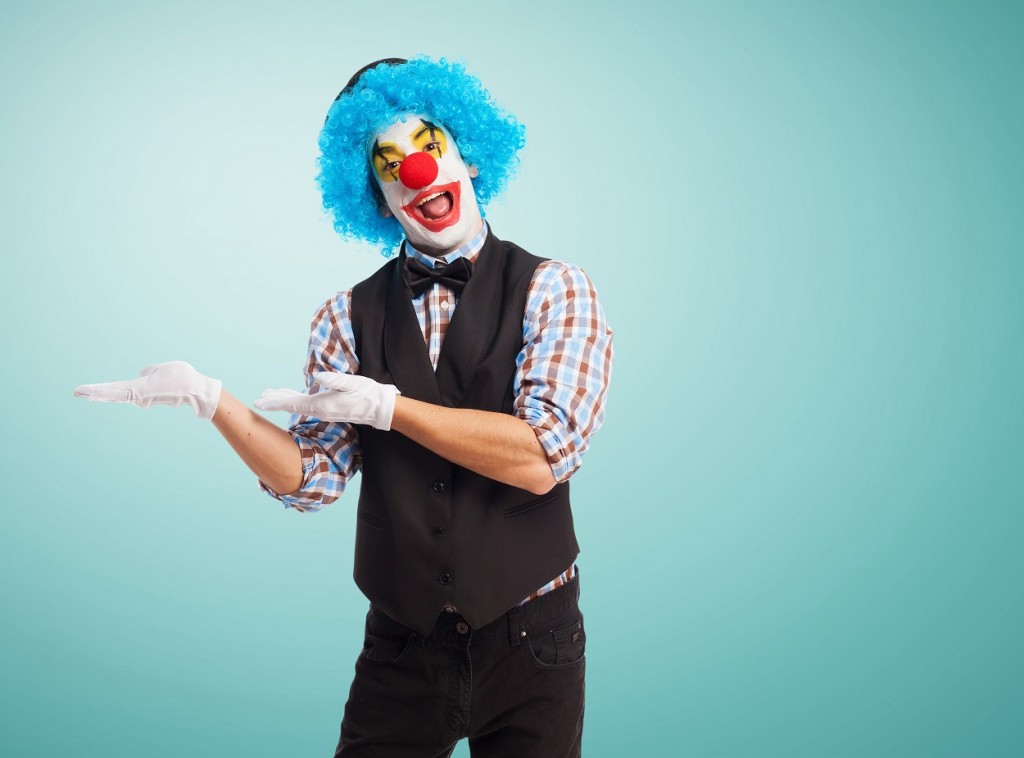 portrait of a funny clown over white