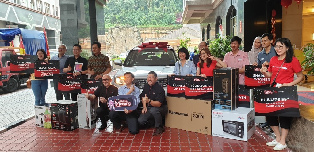 Winners from StarProperty’s home buyer contest in 2019 pose with their prizes alongside Vogiatzakis and Towle.