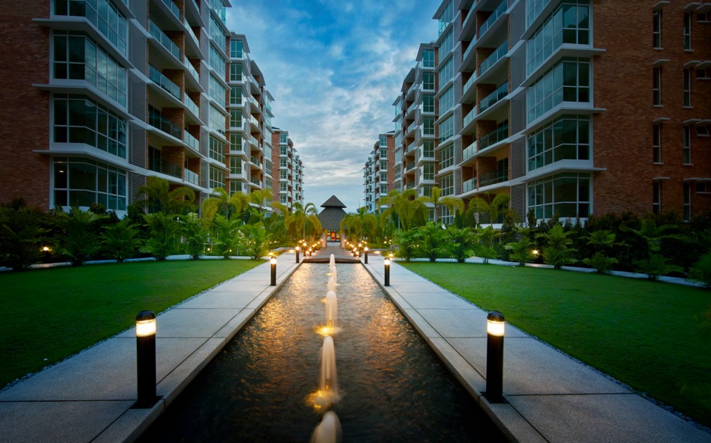 Strategically planted trees and artful lighting provide a quaint atmosphere amidst a bustling city life.