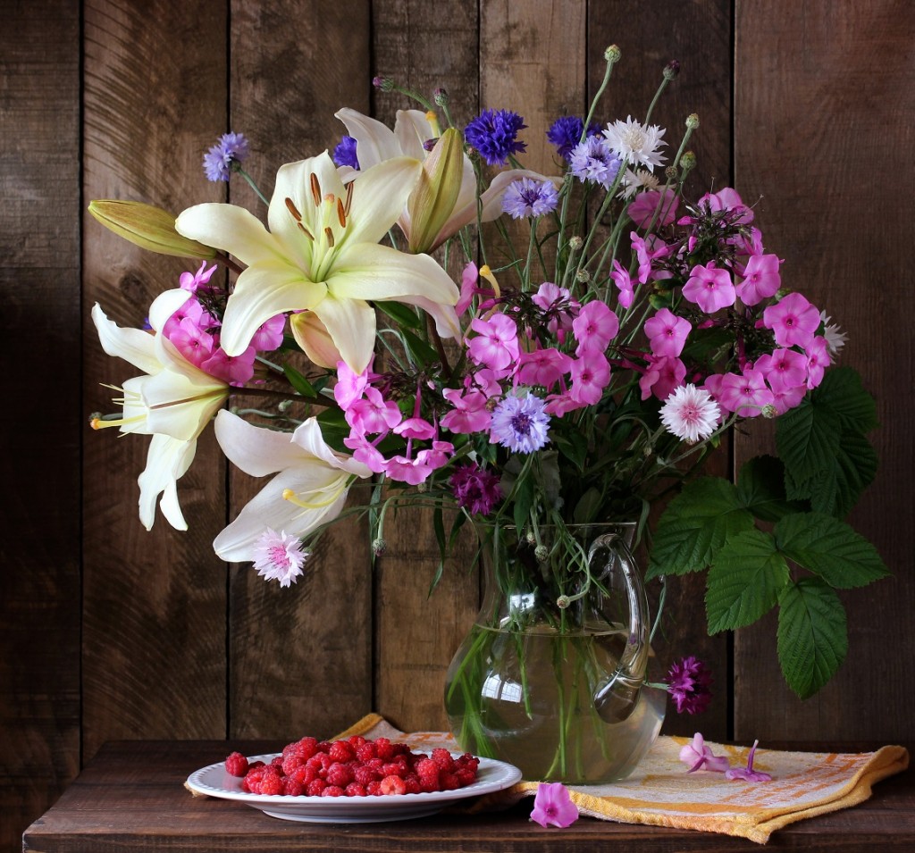 summer bouquet of lilies, phlox and cornflowers in a jug