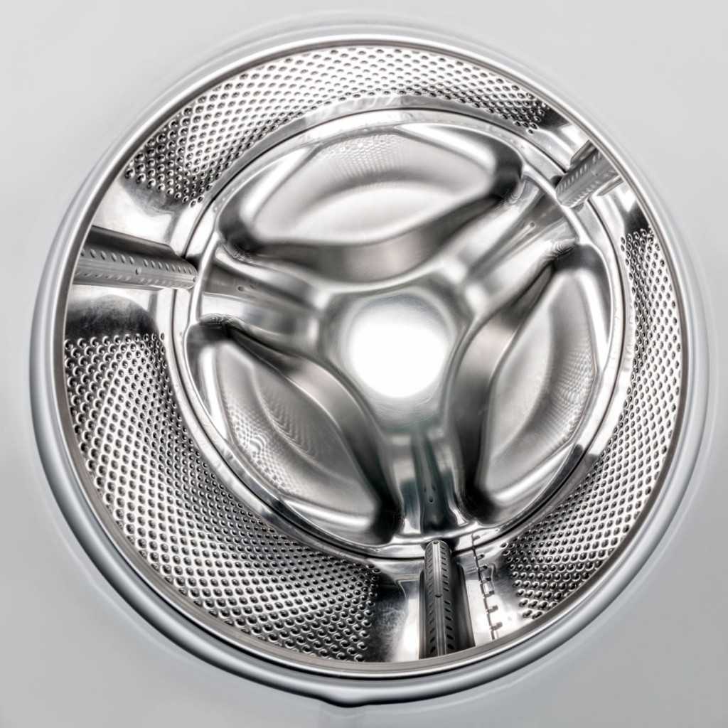 The drum of a washing machine makes a perfect flowerpot holder.